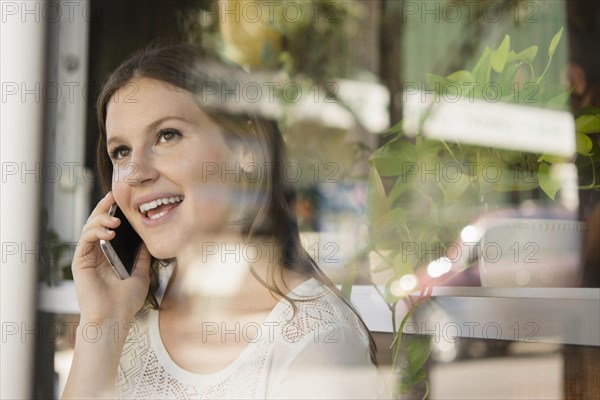 Caucasian woman talking on cell phone