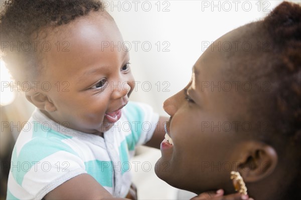 Close up of Black mother and son smiling