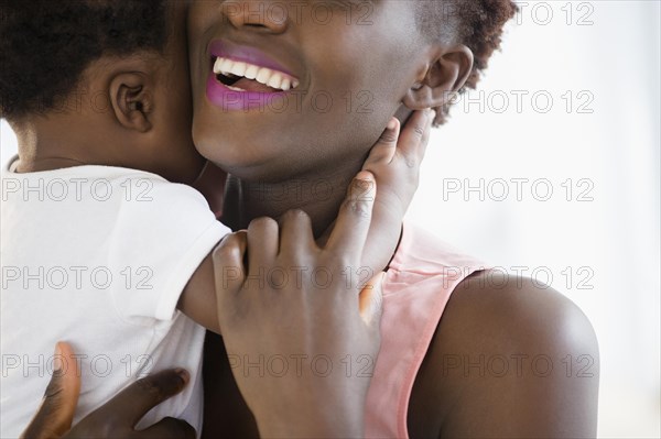 Close up of Black mother holding son