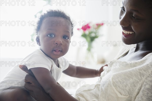 Close up of Black mother holding baby boy