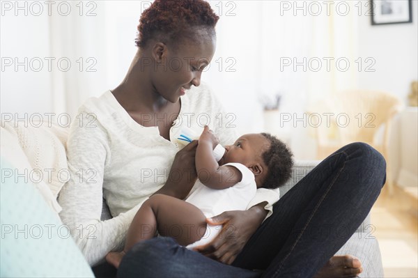 Close up of Black mother feeding baby boy