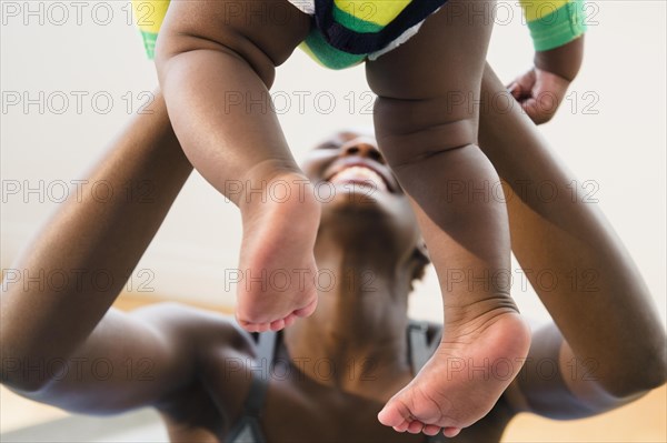 Close up of Black mother playing with baby boy