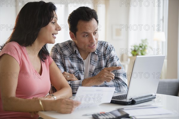 Couple paying bills online