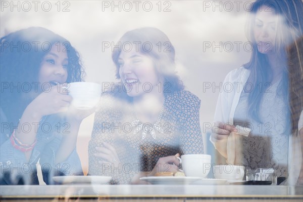 Women drinking coffee in cafe