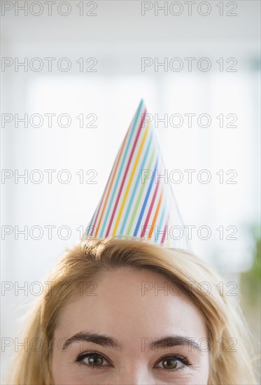 Caucasian woman wearing party hat