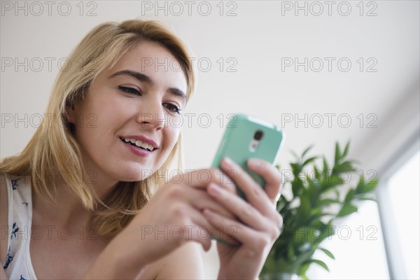 Caucasian woman using cell phone