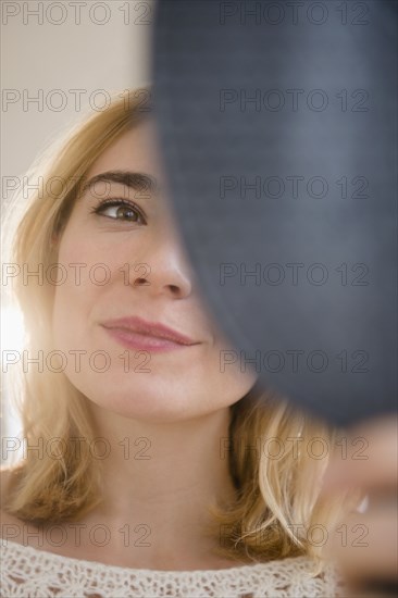 Caucasian woman admiring herself in mirror