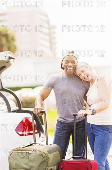 Older couple with luggage on vacation