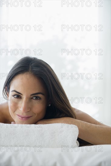 Caucasian woman laying on massage table