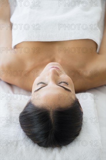 Caucasian woman laying on massage table