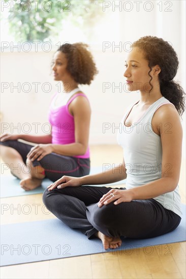 Women meditating in yoga class