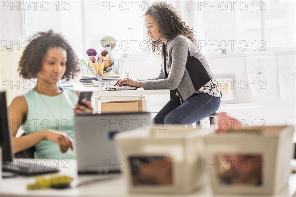 Businesswomen working at desks in office