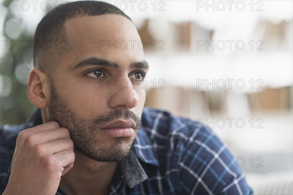 Close up of face of serious Hispanic man