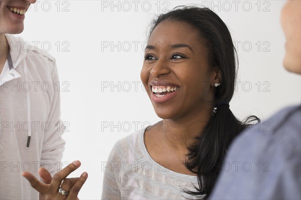 Smiling friends talking