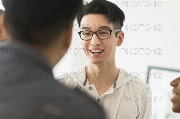 Smiling friends talking