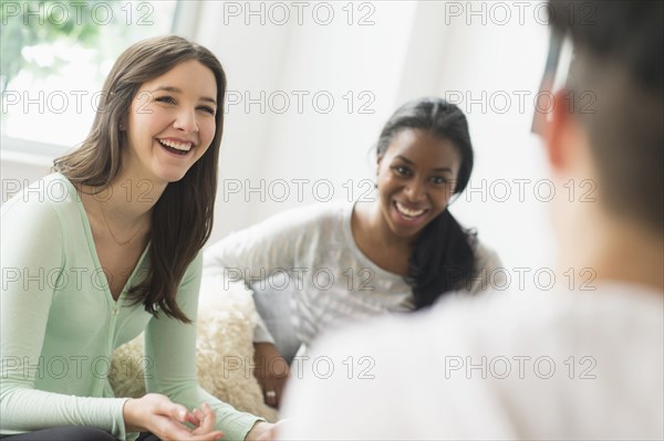 Smiling friends talking