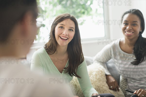 Smiling friends talking