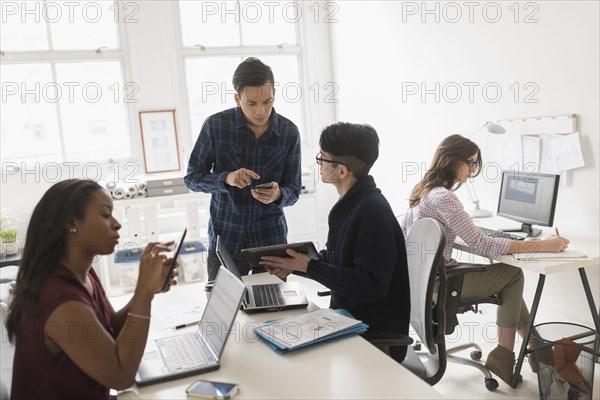 Business people using technology in office