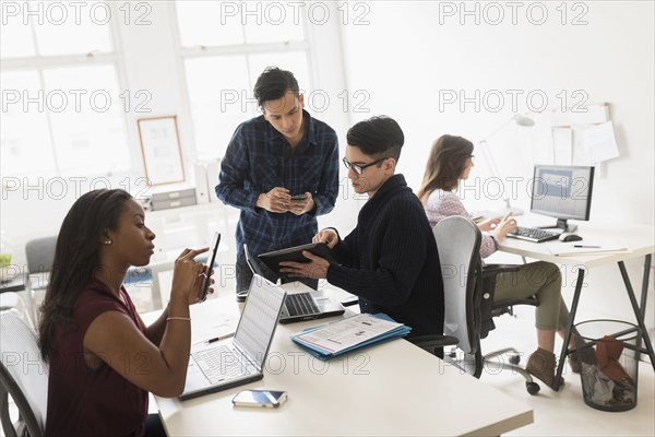 Business people using technology in office
