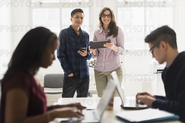 Business people using technology in office