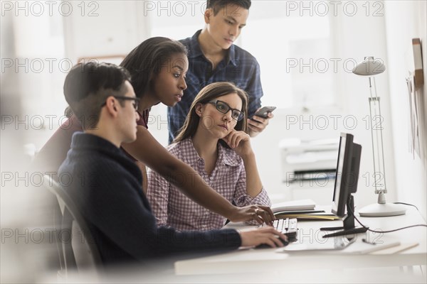 Business people working together at computer