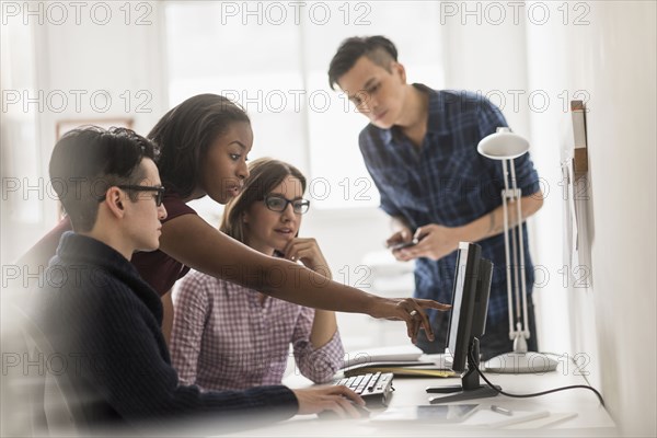 Business people working together at computer
