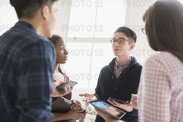 Business people working together in office with technology