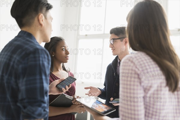 Business people working together in office with technology