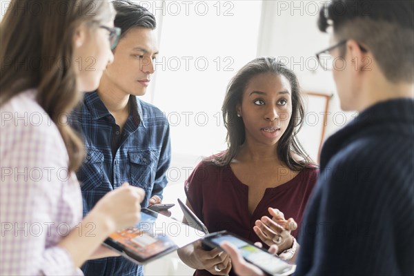 Business people working together in office with technology