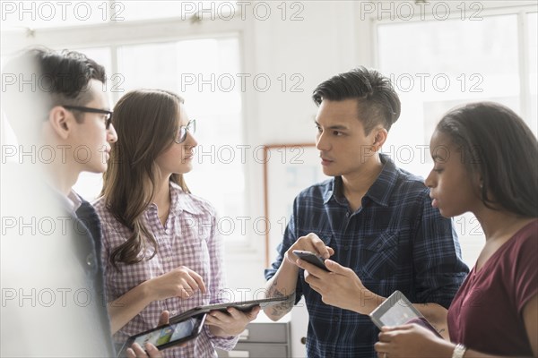 Business people working together in office with technology