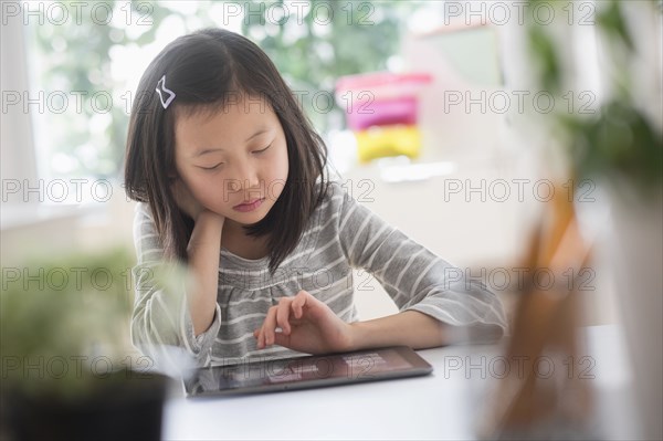 Chinese student using digital tablet