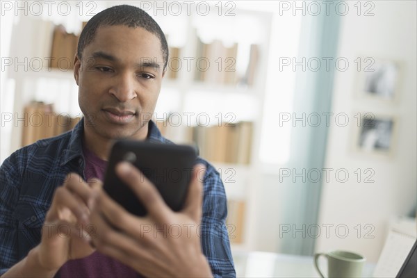 Black man using digital tablet