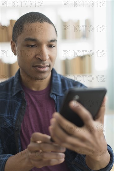 Black man using digital tablet