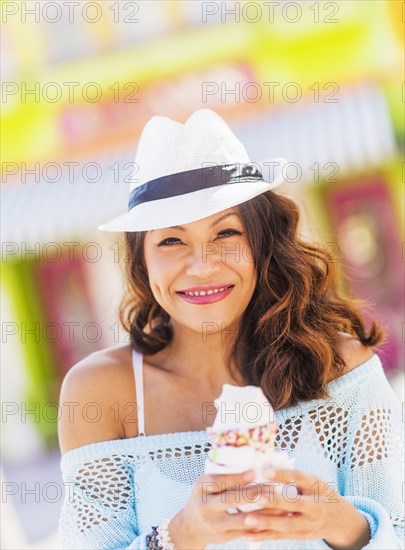 Chinese woman eating ice cream cone