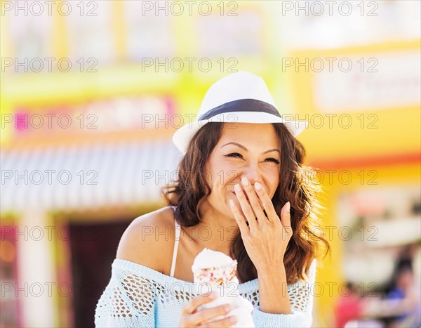 Chinese woman eating ice cream cone