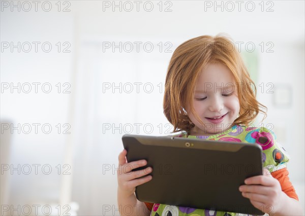 Caucasian girl using digital tablet