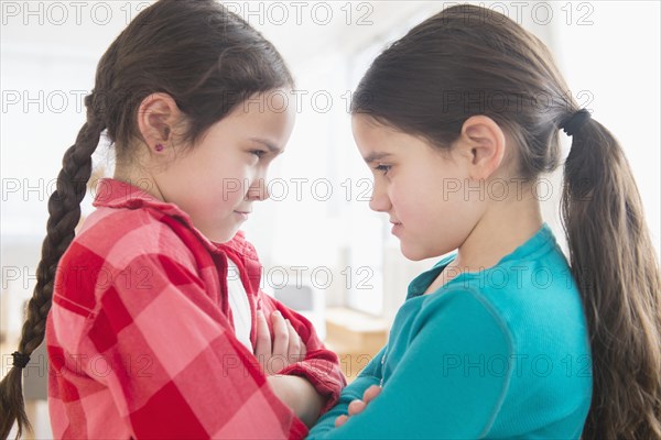 Close up of Caucasian sisters arguing