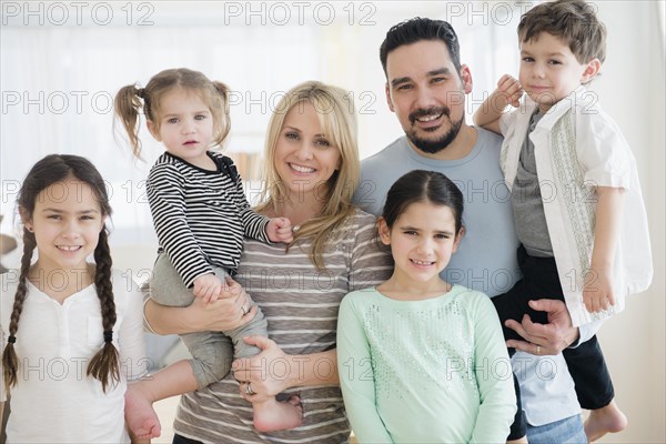 Caucasian parents and children smiling