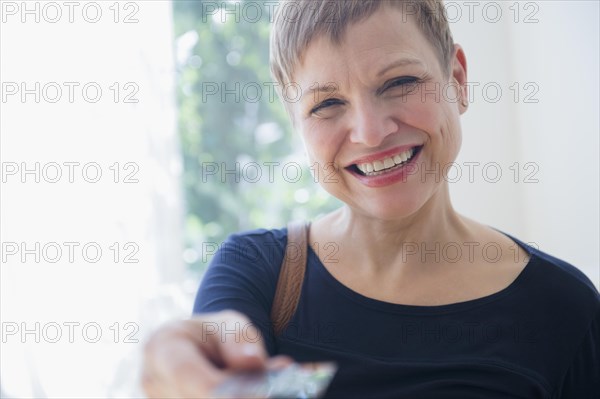 Caucasian woman paying with credit card