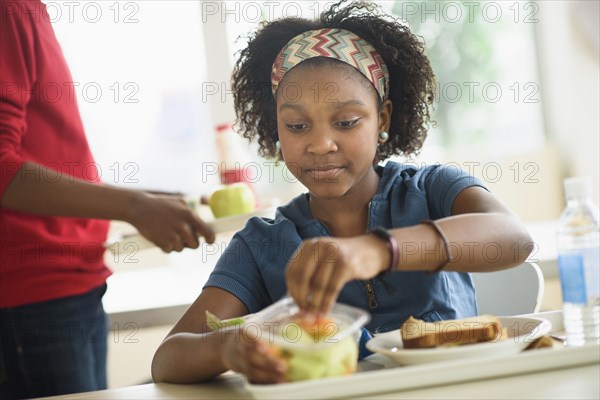 Black students eating lunch in school cafeteria