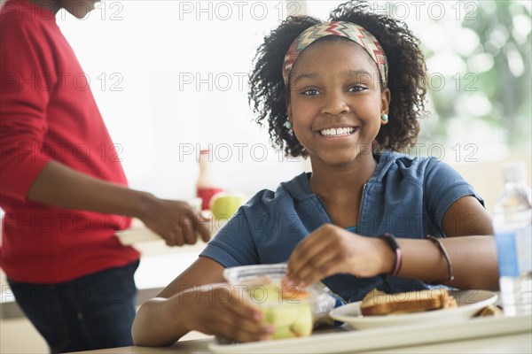 Black students eating lunch in school cafeteria