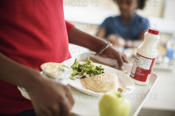 Black students eating lunch in school cafeteria