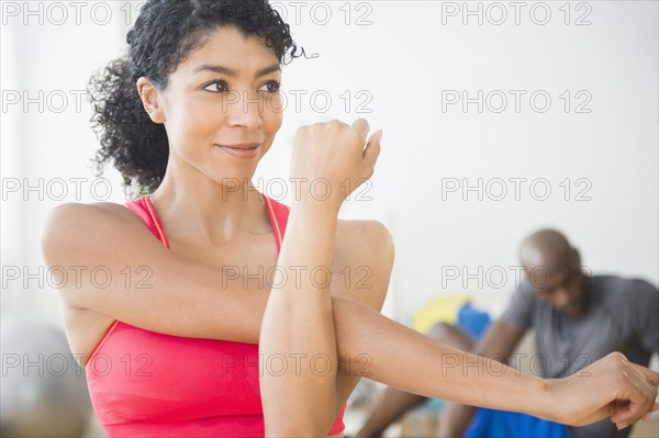 Close up of woman stretching in gym