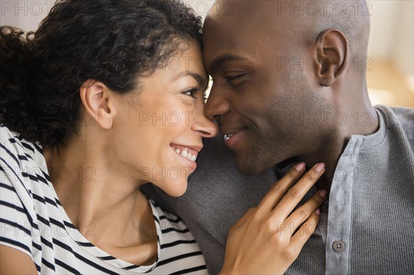 Close up of smiling couple rubbing noses