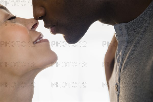 Close up of smiling couple kissing