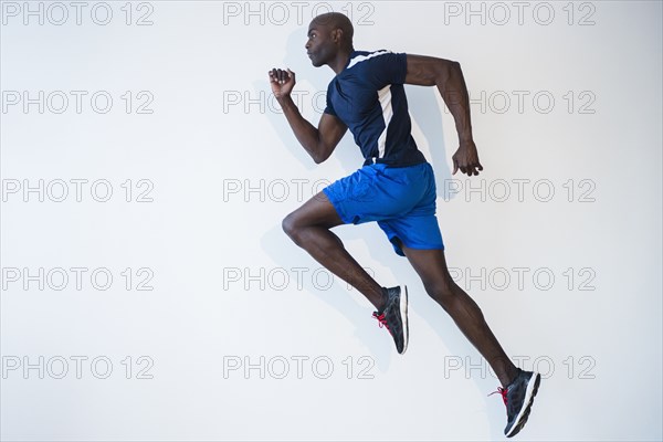 Side view of Black man running