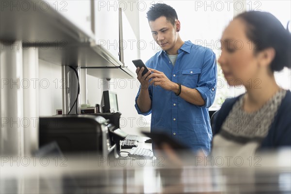 Business people using technology in office