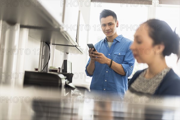 Business people using technology in office