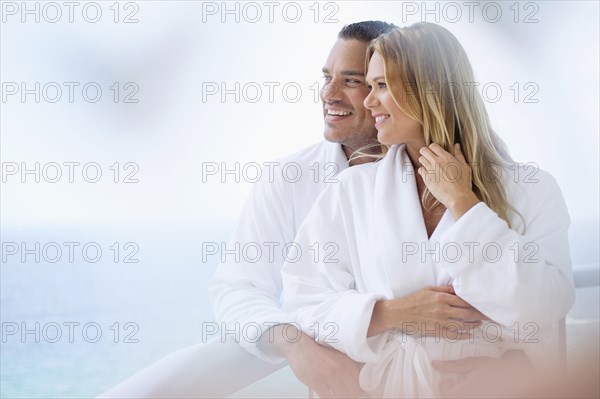 Couple hugging on balcony