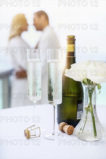 Close up of champagne glasses on balcony table